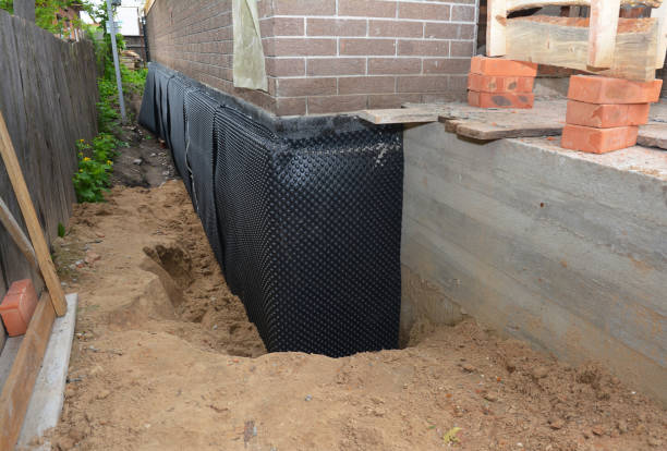 Happy homeowners after waterproofing job in Jackson Center